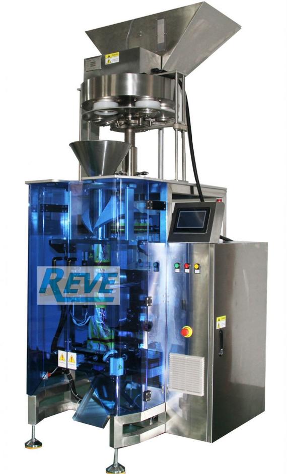 VERTICAL FORM FILL SEAL PACKING MACHINE WITH VOLUMETRIC CUP SYSTEM